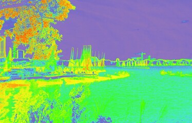 Thermal spectrum view showing marina landscape with boats
