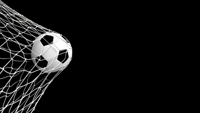 Soccer ball hits the back of the net in a goal on a dark background  sport