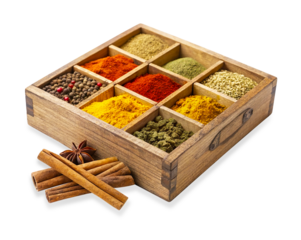 A square wooden box divided into nine compartments, each filled with different colorful ground and whole spices. Cinnamon sticks and star anise are placed next to the box on Transparent background.