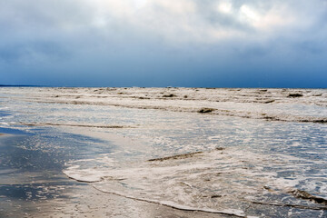Stormy Sea Waves Crashing on Coastline under Dramatic Dark Sky