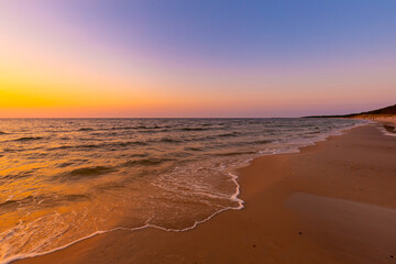 Fototapeta premium Picturesque colorful sunset on the beach on the Baltic Sea in Poland, background or wallpaper for your project