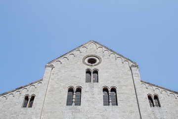 Facade of Romanesque church against clear blue sky