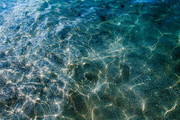 Sunlight reflecting on clear shallow seawater