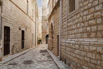 Empty stone alley in historic Italian town