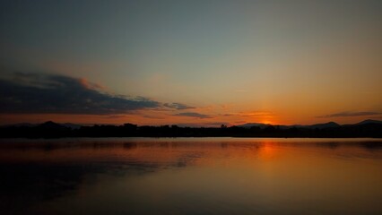 Obraz premium sunset over the river