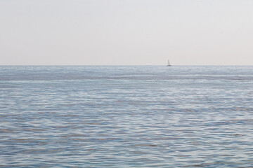 Solitary Sailboat on a Calm Sea