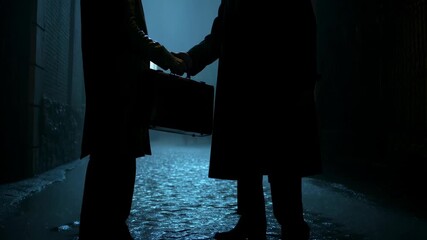 Mysterious exchange in a dimly lit alley capturing suspenseful urban night scene