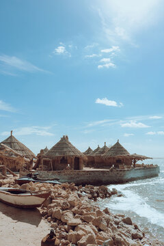 A charming picture of a rest house overlooking Lake Siwa, built of mud bricks.