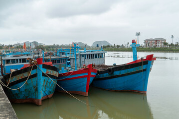 Local fishing industry, maritime transport and coastal lifestyle in Southeast Asia. No people, outdoor daytime scene.
