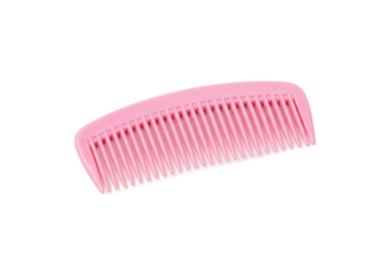 Minimalist pink comb resting on a soft pastel pink surface with gentle lighting