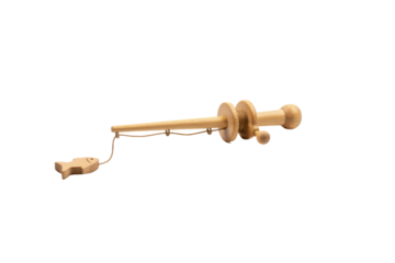 Minimalist wooden fishing rod with tiny fish symbol placed on the plain surface