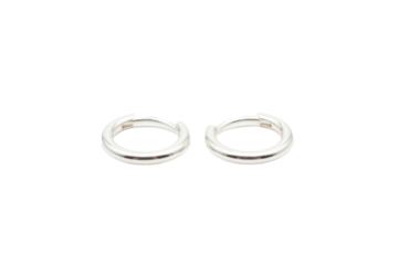 Pair of smooth polished silver rings on a light surface showing reflections