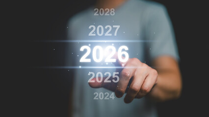 Human hand touch glowing 2026 year virtual timeline interface, symbolizing future planning, time progression, strategic decision making, digital transformation, innovation, long term business vision.