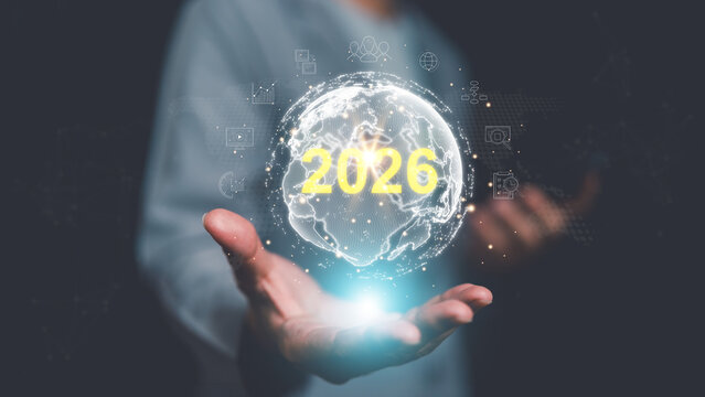 Human hand presenting glowing digital globe 2026 text and data icons, symbolizing global business vision, future technology, digital transformation, worldwide connectivity, strategic growth concept. - Powered by Adobe