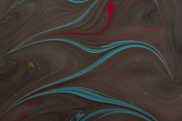 Abstract Ebru marbling art background with swirling liquid ink texture