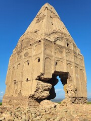 Ancient weathered red brick temple ruins with crumbling masonry, historic architecture, and aged stone textures.