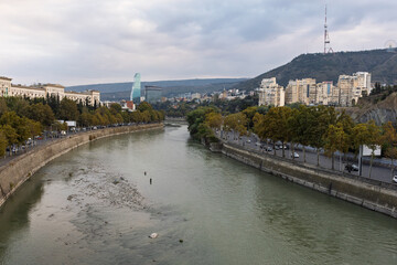 Mtkvari River And Tbilisi City Skyline With Modern And Residential Buildings © Vadim Volodin