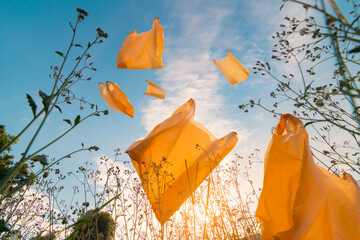 Numerous garbage bags were thrown into the garden. pollution in nature.