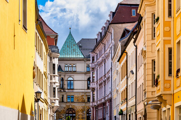 Bautzen city centre lane with historic facades and copper roof in background