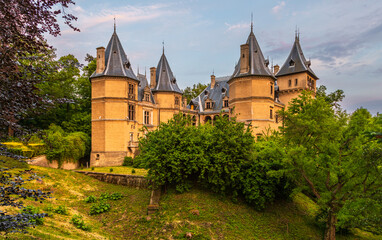 Historic castle surrounded by green park landscape in Goluchow. Poland.