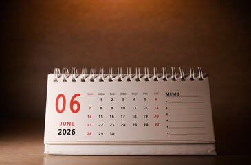 Calendar page of June 2026 on desk, with copy space. monthly planning concept, important schedules, meetings, and appointments.