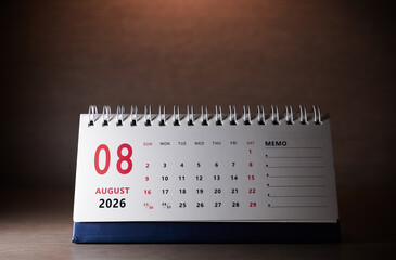 Calendar page of August 2026 on desk, with copy space. monthly planning concept, important schedules, meetings, and appointments.