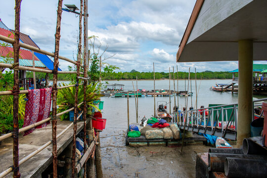 Koh Panyi floating Muslim village in Thailand. Boats and limestone rock formations on Andaman Sea, Phi Phi islands 