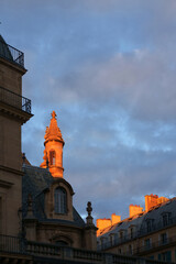 View over the rooftops of Paris, France, the Saint-Germain-des-Pr&eacute;s area. The warm, golden light