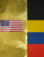 Flag USA. Grunge black and gold backgrounds, symbolizing oil as black gold. The national colors of the flag of Venezuela.