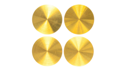 Four polished, circular, metallic discs with radial patterns on a black background