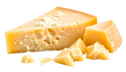 Close-up of a wedge and several cubes of hard, aged, yellowish-brown dairy product
