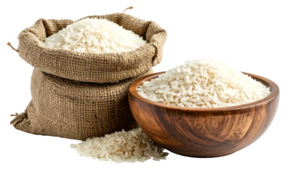 A burlap sack and wooden bowl overflow with white rice. Grains spill out