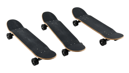Three angled skateboards, each with black grip tape and wheels, isolated on a void background