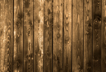 Weathered brown wood planks with peeling paint show rustic texture detail, ideal for background or design texture of a deck floor made of aged wooden planks with faded gray color, grain small gaps.
