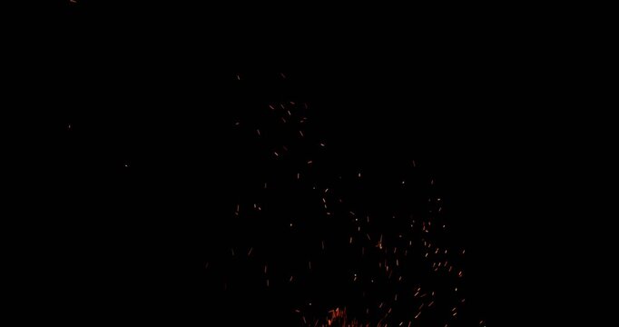 Realistic fire sparks flying through the air in slow motion, isolated on a black background. Perfect as a cinematic VFX overlay, fire particles effect or visual element. Shot in slow motion.
