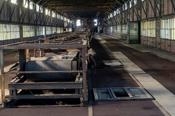 Abandoned industrial hall with conveyor system