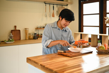 Simple food preparation scene showing a relaxed lifestyle, natural light, and fresh vegetables in a modern home kitchen
