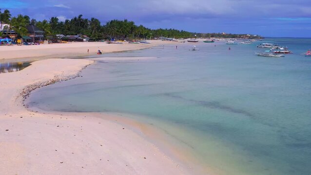 Aerial view of curved sandbar and shallow lagoon