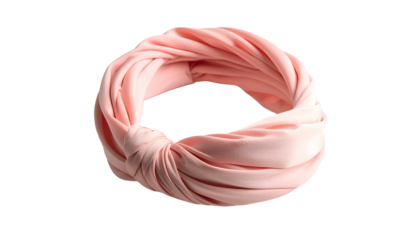 A light pink knotted headband against a black background