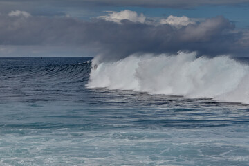 Naklejka premium Punta Carola, home to one of the most famous and challenging surf breaks on San Cristóbal Island. Known for its powerful right-hand reef break, this spot is a favorite for experienced surfers seeking 
