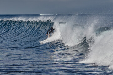 Naklejka premium Punta Carola, home to one of the most famous and challenging surf breaks on San Cristóbal Island. Known for its powerful right-hand reef break, this spot is a favorite for experienced surfers seeking 