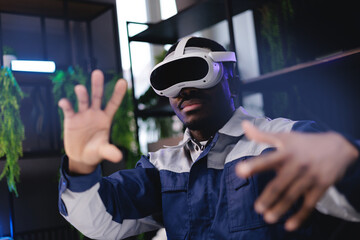 African American male adult using vr headset for virtual reality experience in modern setting