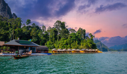 Scenic view of khao sok national park with floating houses and lush jungle at sunset in thailand