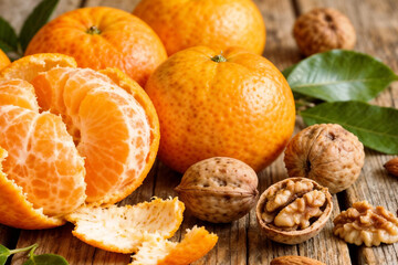 Fresh Mandarins and Walnuts on Rustic Wooden Table by generative AI technology