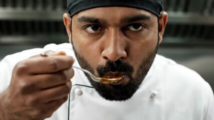 Indian Chef Tasting Food in Restaurant Kitchen Professional Cook