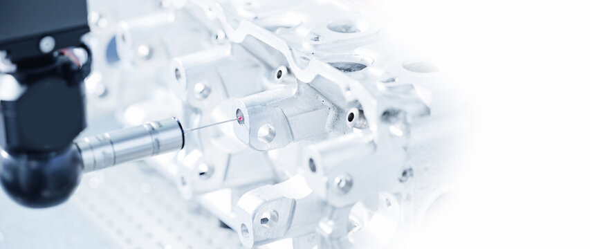 Cnc coordinate measuring machine inspecting metal component for precision engineering