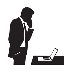 A silhouette of a man thinking while using a laptop at a desk