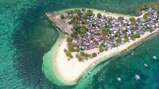 Aerial view of tropical island village and sandy beach