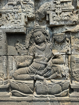 Relief of goddess carved in Borobudur Buddhist Temple in Central Java, Indonesia