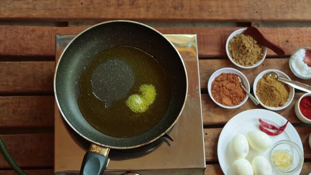 adding salt and turmeric powder, then frying